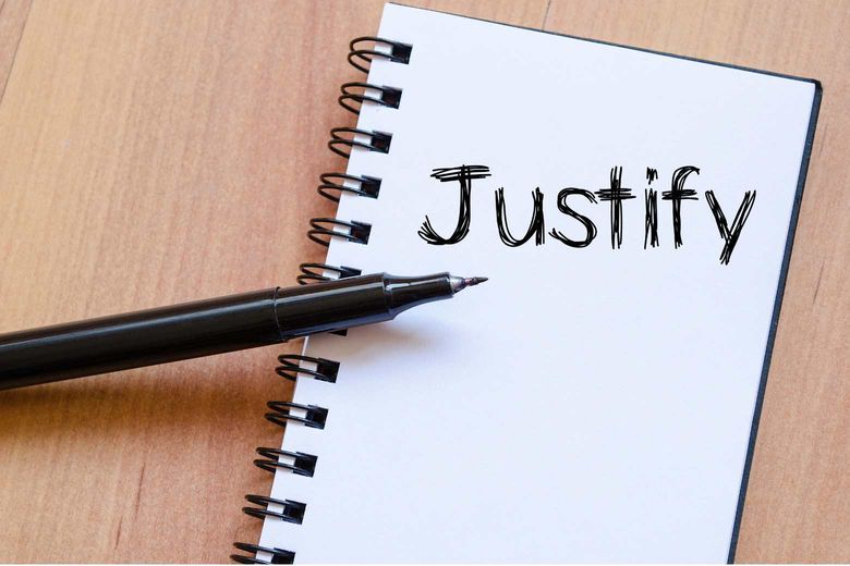 a note pad with the word justify written in pen